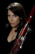 Amy Pollard posing with her bassoon