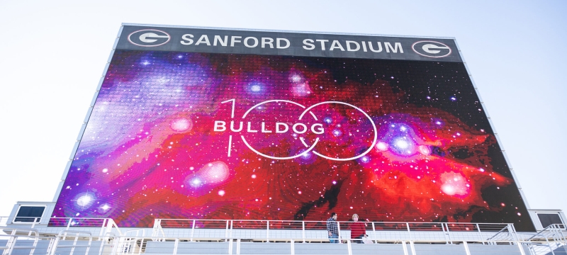 photo of stadium Jumbotron with Bulldog 100 graphic