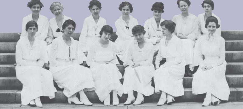historical photo of women seated on steps