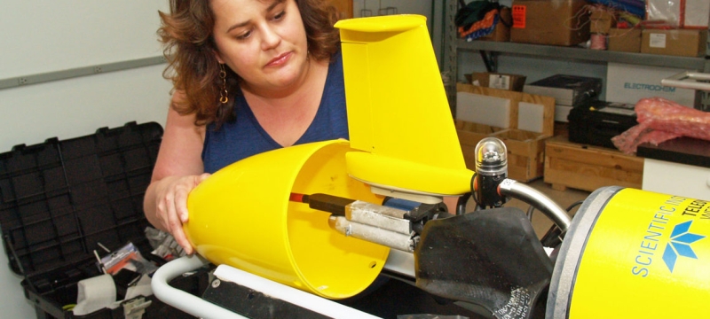 photo of woman with underwater robotic glider