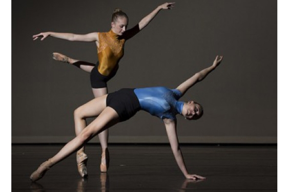 photo of two ballet dancers on stage