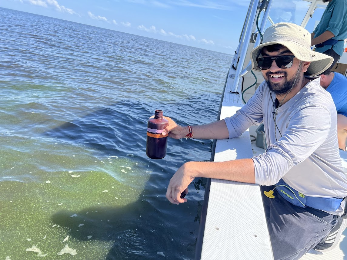 Photo of researcher about vessel on water, day.
