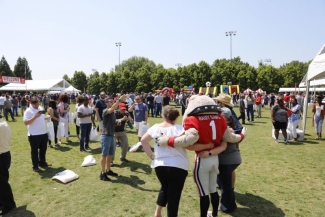 UGA employees take a picture with Hairy Dog