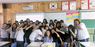 photo of woman with students in classroom