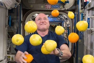 man juggling in space craft