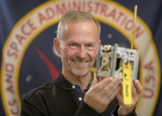 photo of man holding a phonesat