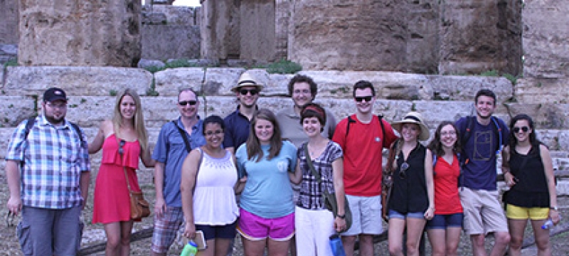 students with Greek ruins