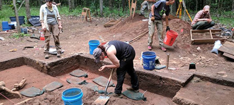 students working on archeological excavation