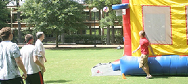 people with bounce house outside
