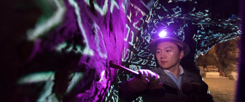 Environmental portraits of Jaewoo Lee "data mining" in a gold mine.