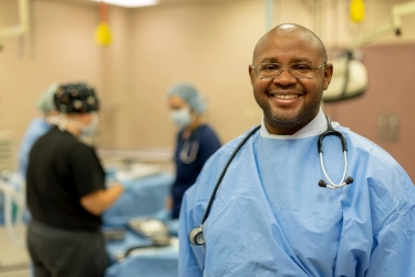 photo of man in scrubs with stethoscope