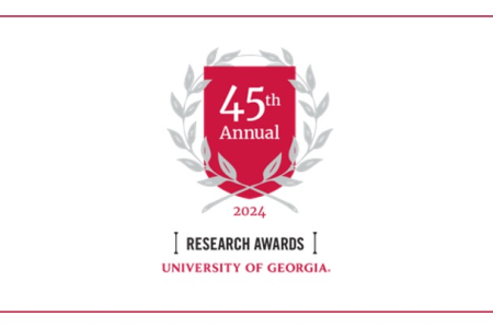 graphic with red crest, laurels, and text