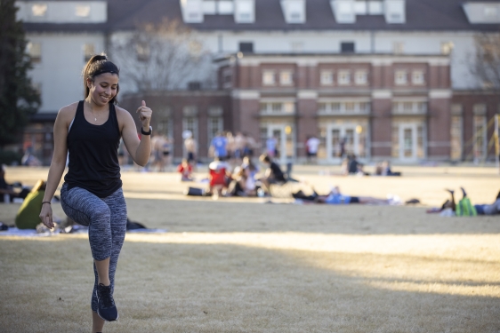 photo of student quad, with woman in foreground