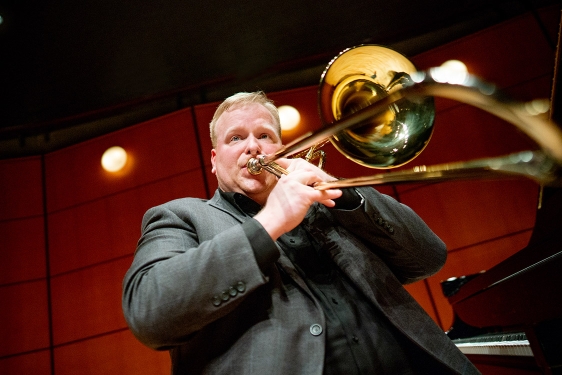 photo of man playing trombone