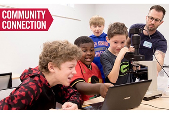 photo of kids with microscope and computer