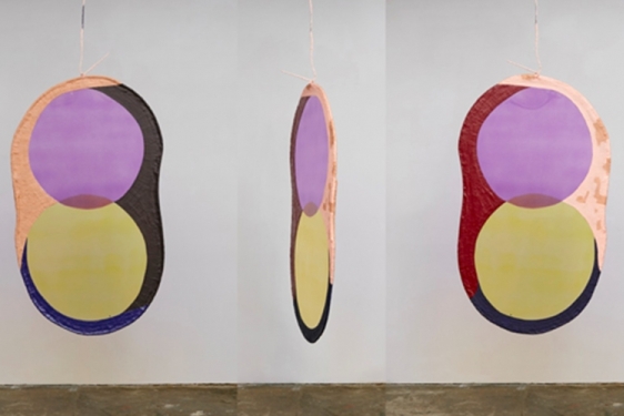 photo of three colorful mobiles with circles, hanging
