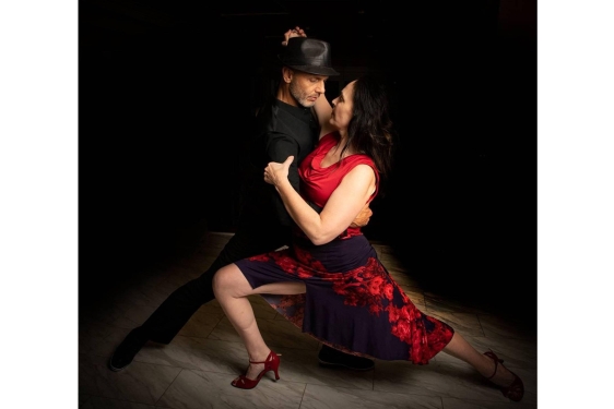 photo of two dancers with black background