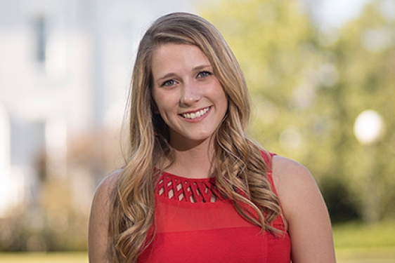 photo of woman with campus background