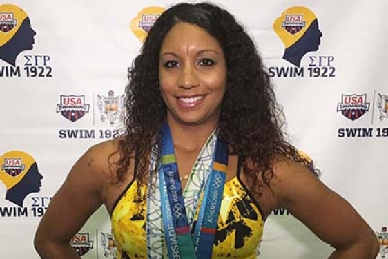 photo of woman with olympic medals