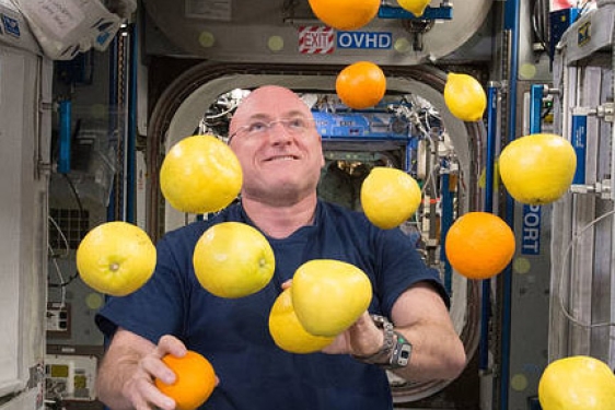 man juggling in space craft