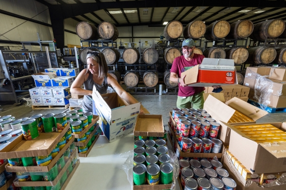 photo of two people at food pantry warehouse