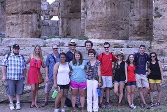 students with Greek ruins