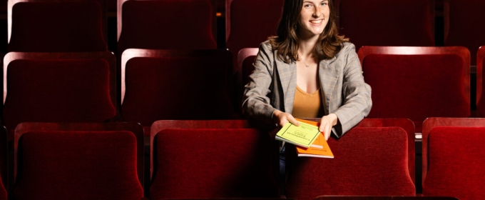 photo of woman in theatre seats