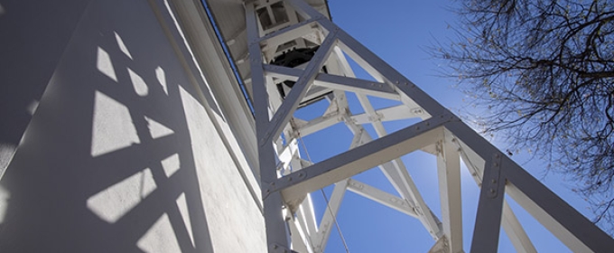 photo of bell tower and blue sky from below