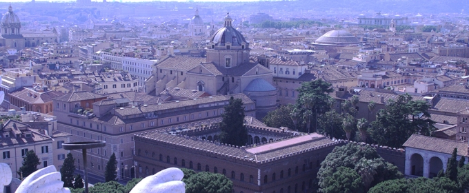wide photo of Rome, with St. Peter's and the pantheon in the distance