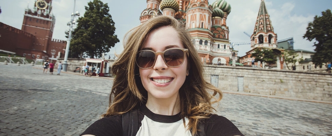 selfie photo of woman with orthodox cathedral in background