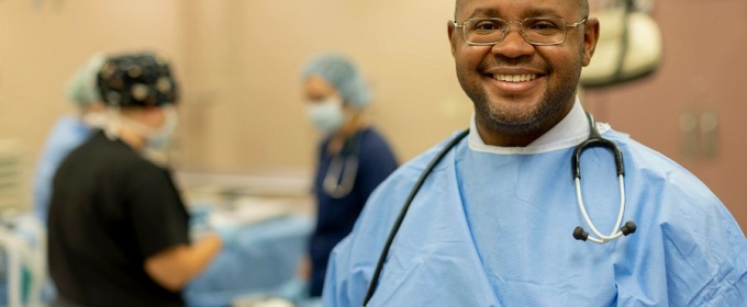 photo of man in scrubs with stethoscope