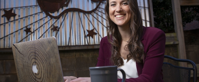 photo of woman with laptop and up of coffee, seated