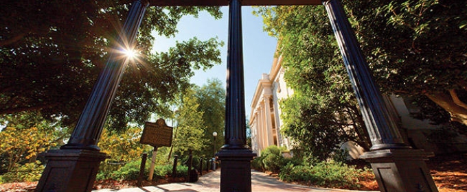 stretched photo of UGA arch day