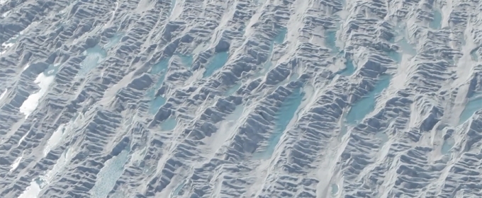 aerial photo of water puddles on glacier